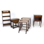 A group of four pieces of furniture, comprising a nest of three mahogany tables with quarter