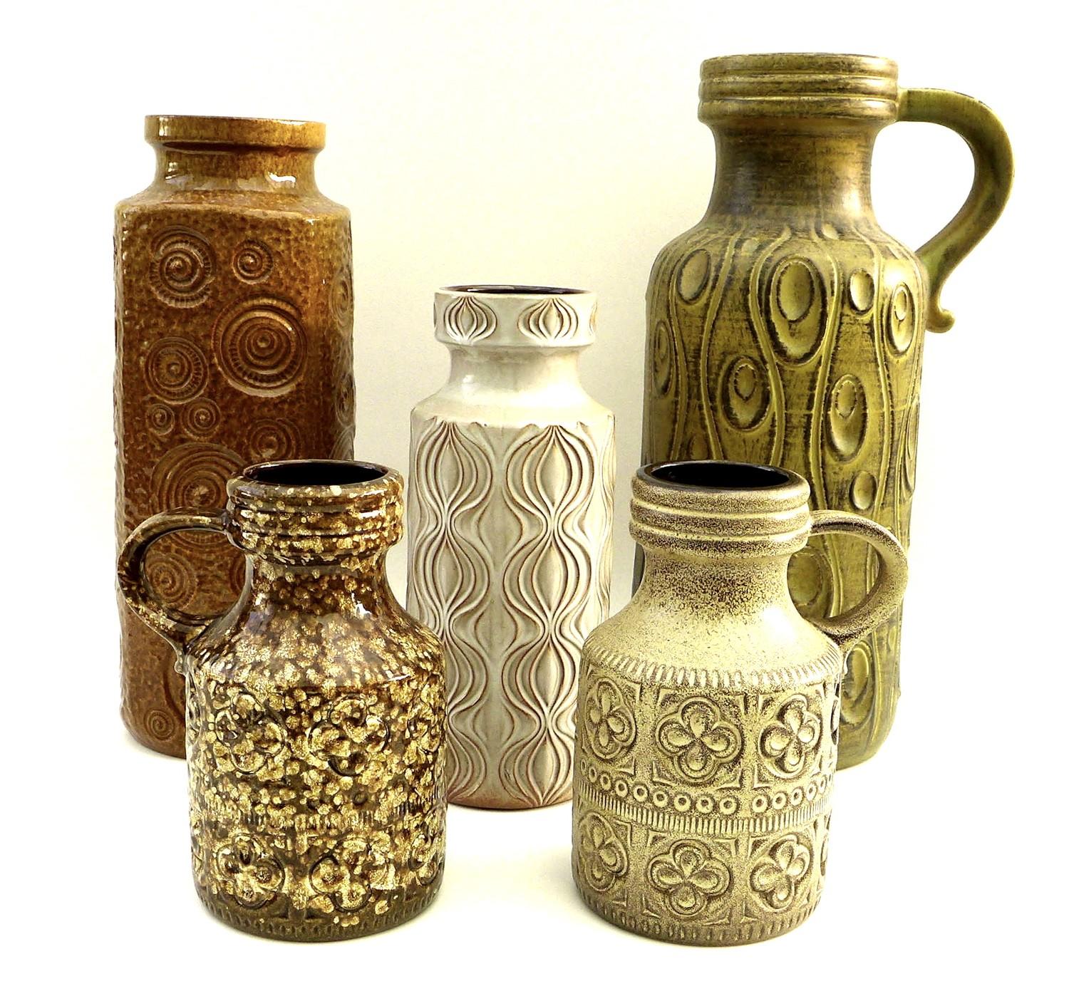 A group of five West German pottery vases of cylindrical form, comprising a large handled vase,