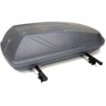 A modern roof box, black with black metal roof bars, a/f missing its key, 145 by 118 by 47cm high.