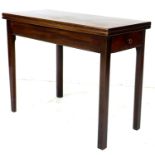 A Victorian mahogany tea table, fold over surface, single frieze drawer with turned handle, raised