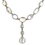 An Art Deco white metal and moonstone pendant necklace, formed of a single string of ninety