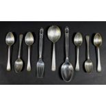 A collection of Danish and British silver flatware, comprising a Georg Jensen Christening spoon,