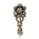 An early 19th century yellow metal and diamond flowerhead brooch, central 4mm rose cut stone