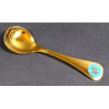A Georg Jensen gilt Sterling silver 1972 year spoon, with enamel corn marigold to its finial,