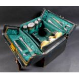 A Victorian/Edwardian Vanity case with silver dressing table wares, featuring three Victorian silver