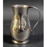 An ERII silver milk jug with planished finish, Howard Jesse Brown, London 1952, 8 by 5.5 by 9cm