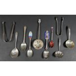 A group of ten silver items, comprising four sifter spoons, largest 15cm, commemorative George V