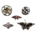 A collection of five brooches, comprising an Edwardian Scottish silver butterfly shaped brooch,