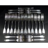 A part suite of George III silver forks, fiddle pattern, armorial crest engraved terminals,