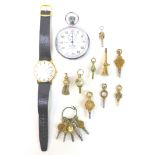 A group of watch keys, including a 14ct gold example engraved with a foliate design and set with a