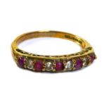 A 9ct gold, diamond and ruby nine stone ring, the round cut stones alternately set in a single
