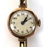 An Art Deco 9ct gold cased lady's wristwatch, circular silvered dial, black Arabic numerals, on a