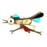 A Native American white metal brooch pendant, in the form of a chicken, set with enamel and semi