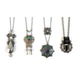 A group of four white metal Art Nouveau style and Art Deco levalier necklaces, comprising one of