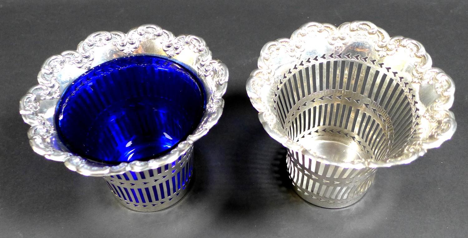 A pair of Edwardian silver baskets, of decagon form with shaped scroll rims and pierced decoration - Image 2 of 7