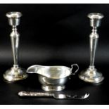A pair of silver candlesticks, each 21cm high with weighted bases, Francis Howard, Birmingham