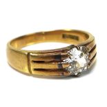 An 18ct gold and diamond solitaire ring, the central old cut diamond of approximately 0.85ct,