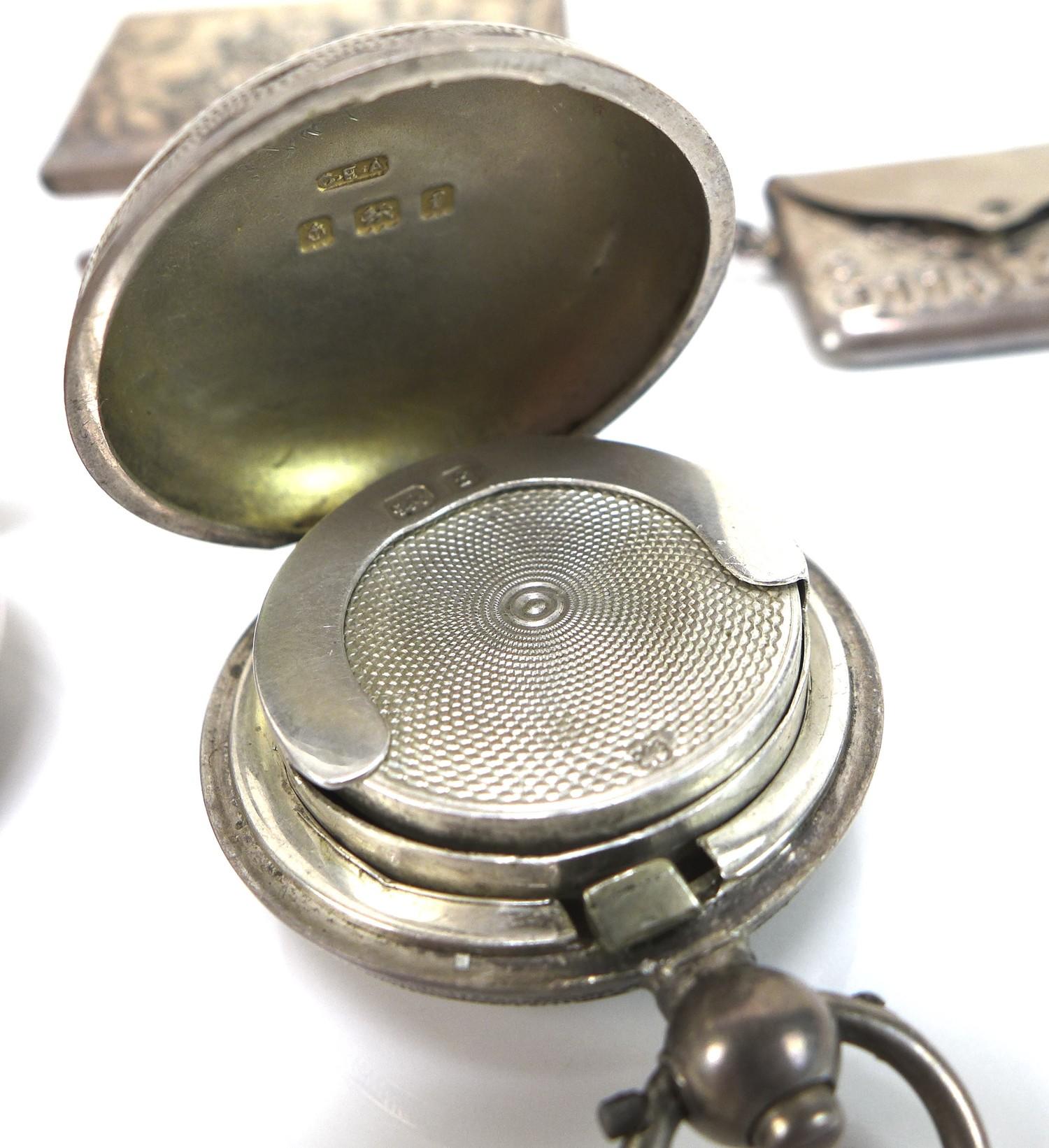 A group of Edwardian silver vertu items, comprising two sovereign holders, two stamp holders, and - Image 6 of 7