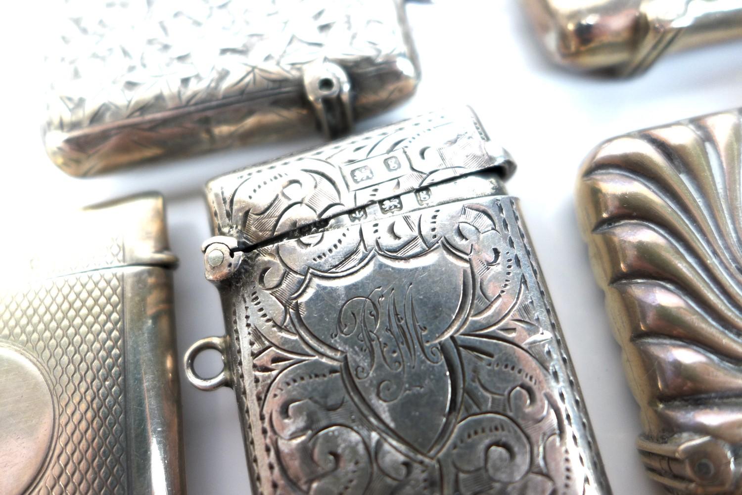 A group of Edwardian silver vesta cases, including a round example with engraved swirling - Image 2 of 3