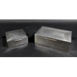 Two George V silver cigarette boxes, comprising a rectangular form box with 'Angus' inscribed to its