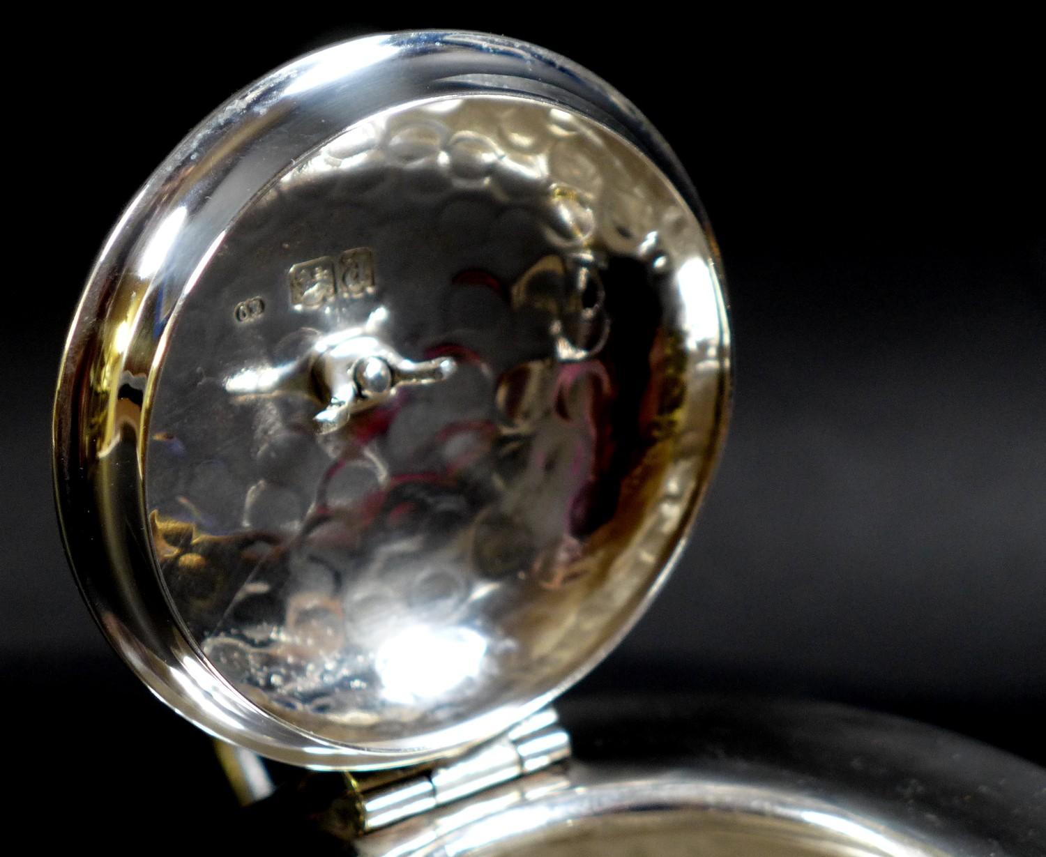 An Arts & Crafts silver teapot, of compressed ovoid form, with all over hammered finish, ebonised - Image 6 of 9