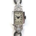 A lady's platinum and diamond set cocktail watch of Art Deco design, set with fourteen diamonds,