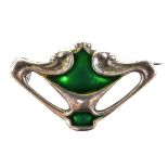An Art Nouveau Charles Horner silver brooch, of organic pierced form, decorated with green enamel,