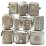 A group of Edwardian silver vesta cases, including one with embossed decoration of a lady golfer