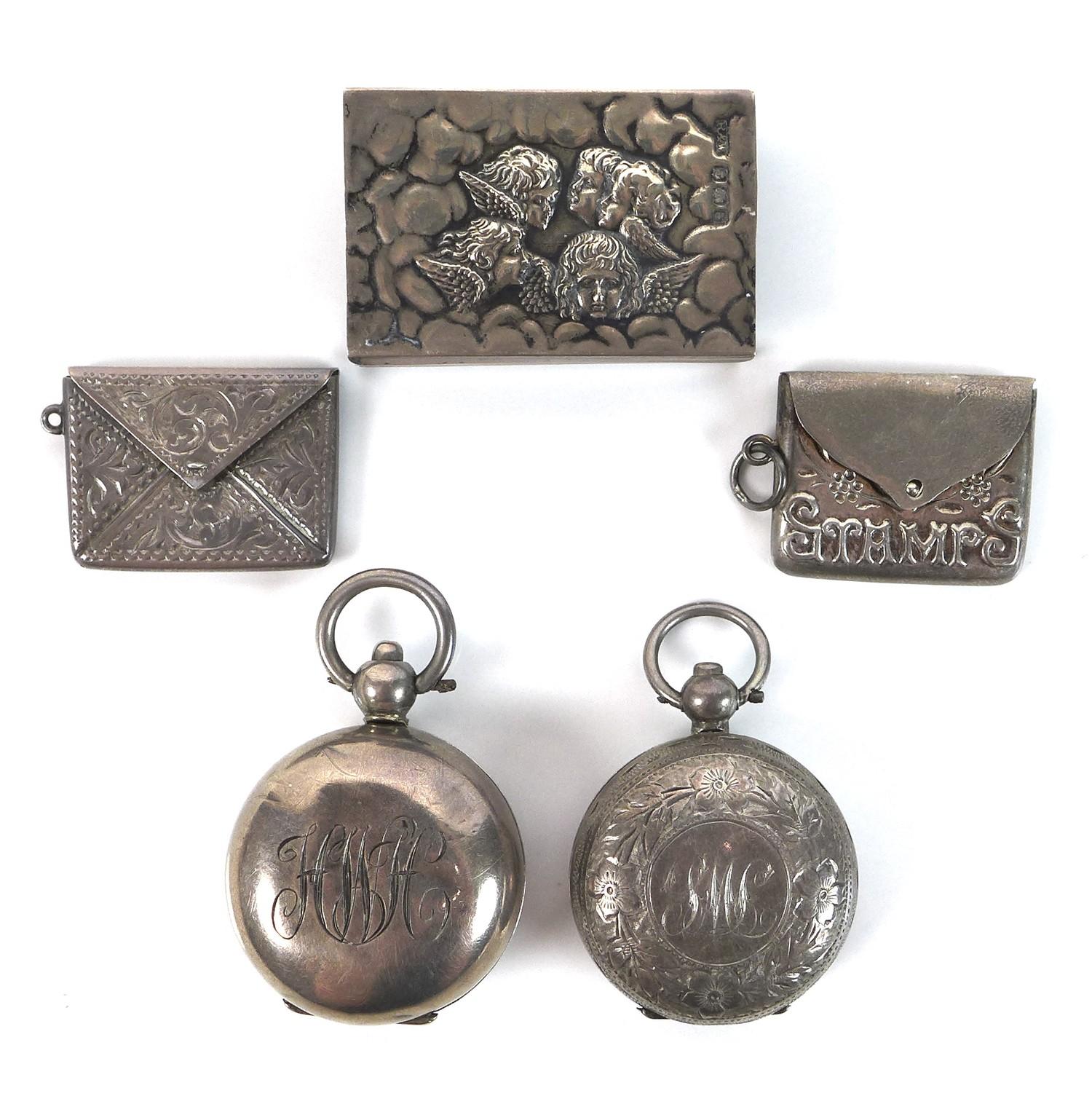 A group of Edwardian silver vertu items, comprising two sovereign holders, two stamp holders, and