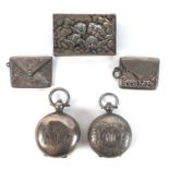 A group of Edwardian silver vertu items, comprising two sovereign holders, two stamp holders, and