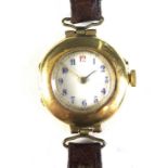 An Edwardian 18ct gold cased lady's wristwatch, circular white enamel dial, blue enamelled Arabic