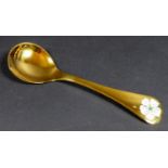 A Georg Jensen gilt Sterling silver 1971 year spoon, with enamel cherry blossom to its finial,
