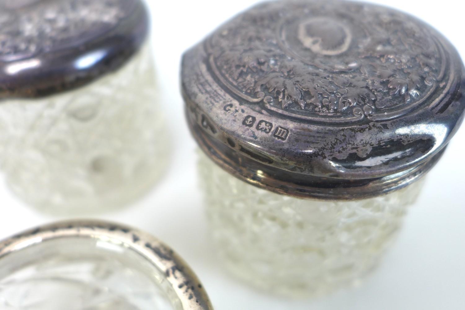 A group of silver topped dressing table items, including glass cosmetics pots, a nail buffer, and - Image 3 of 3