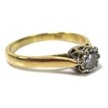 An 18ct gold and diamond solitaire ring, illusion set with diamond of approximately 0.25ct, 3.4mm