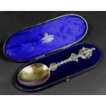 A Victorian commemorative silver gilt spoon, with 18th century style sailing ship to its finial,