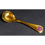 A Georg Jensen gilt Sterling silver 1974 year spoon, with enamel corn cockle to its finial, Designed