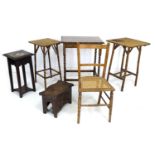 A group of vintage furniture, comprising two bamboo side tables, an oak table with barley twist