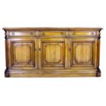 A modern French style oak sideboard, three frieze drawers over three cupboard doors enclosing