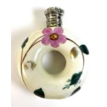 An early 19th century ceramic scent bottle, of donut / doughnut form, decorated with pink flowers