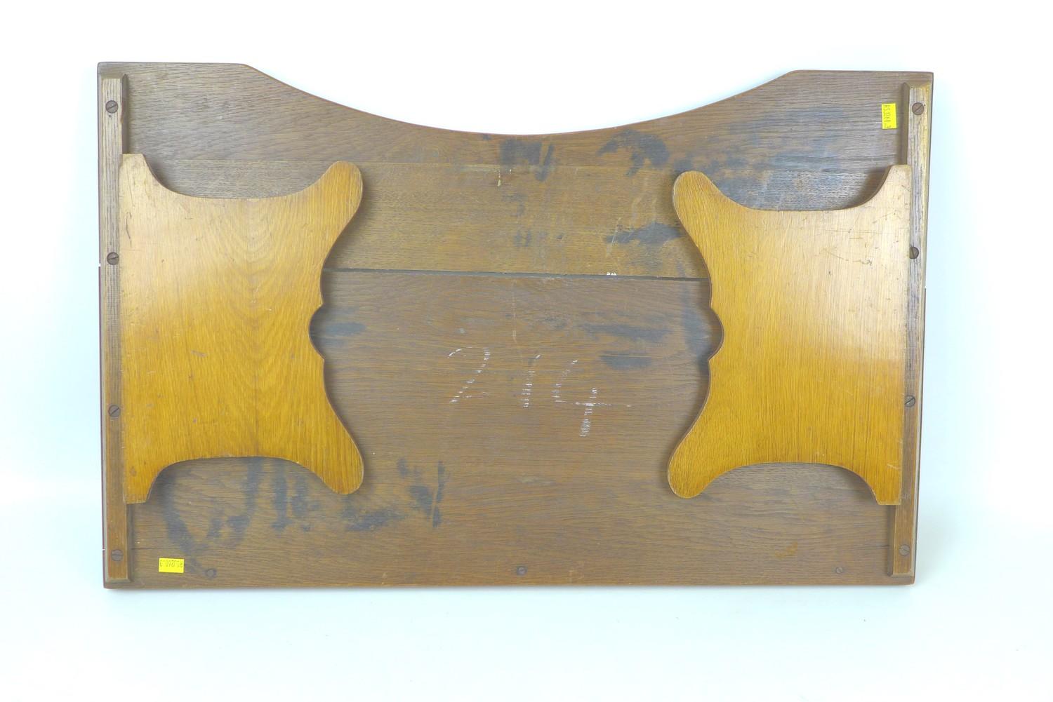 An early to mid 20th century oak bed tray, with folding legs, 68 by 43 by 24cm high, with legs down. - Image 5 of 5