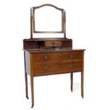 An Edwardian mahogany dressing chest, with mirror over trinket drawer, three drawers below, raised