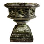 An early 20th century reconstituted stone ecclesiastical style garden planter, of octagonal form