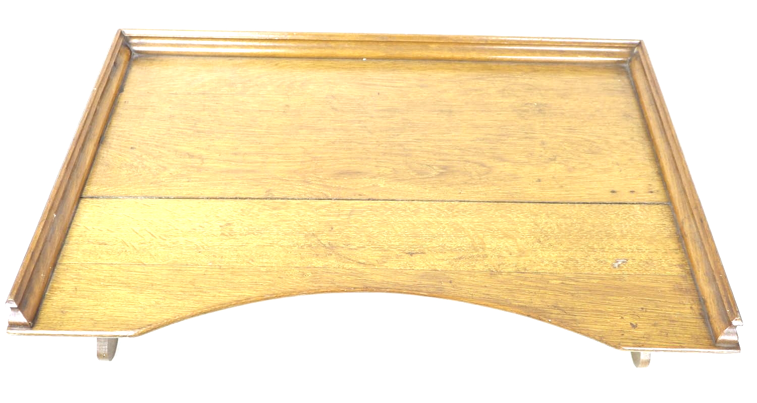 An early to mid 20th century oak bed tray, with folding legs, 68 by 43 by 24cm high, with legs down. - Image 3 of 5