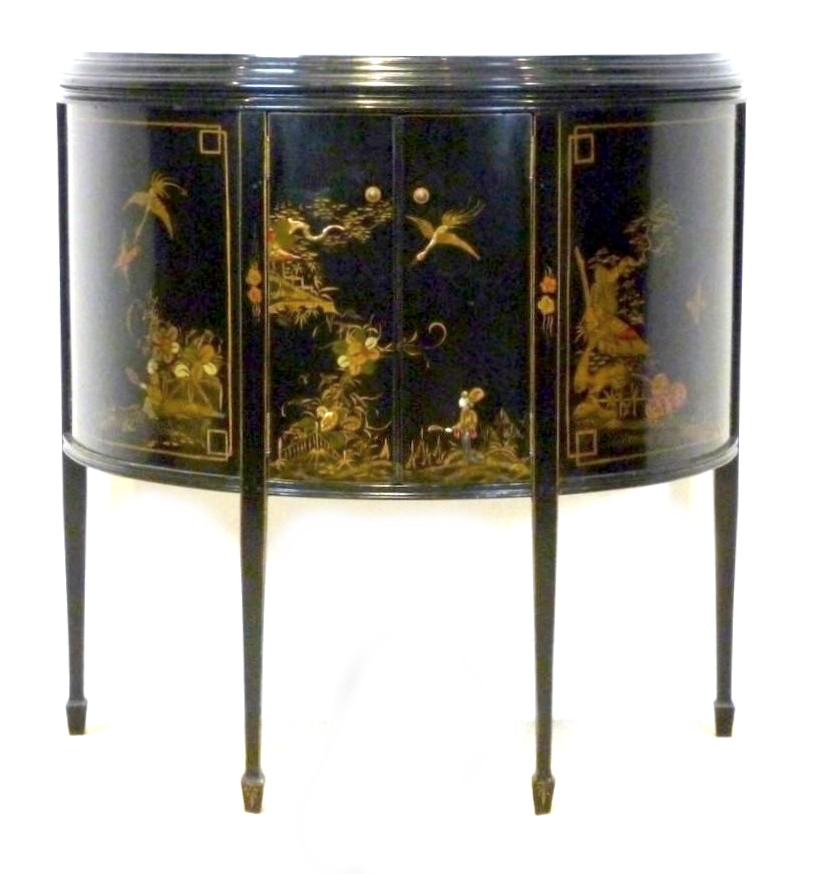 A Japanese black lacquered demi lune sideboard, circa 1910, with two doors enclosing a single shelf,