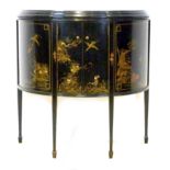 A Japanese black lacquered demi lune sideboard, circa 1910, with two doors enclosing a single shelf,