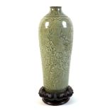 A Chinese pottery celadon glaze vase, Qing Dynasty, 17th / 18th century, of tapering sleeve form,