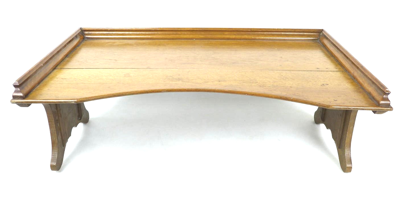 An early to mid 20th century oak bed tray, with folding legs, 68 by 43 by 24cm high, with legs down. - Image 2 of 5