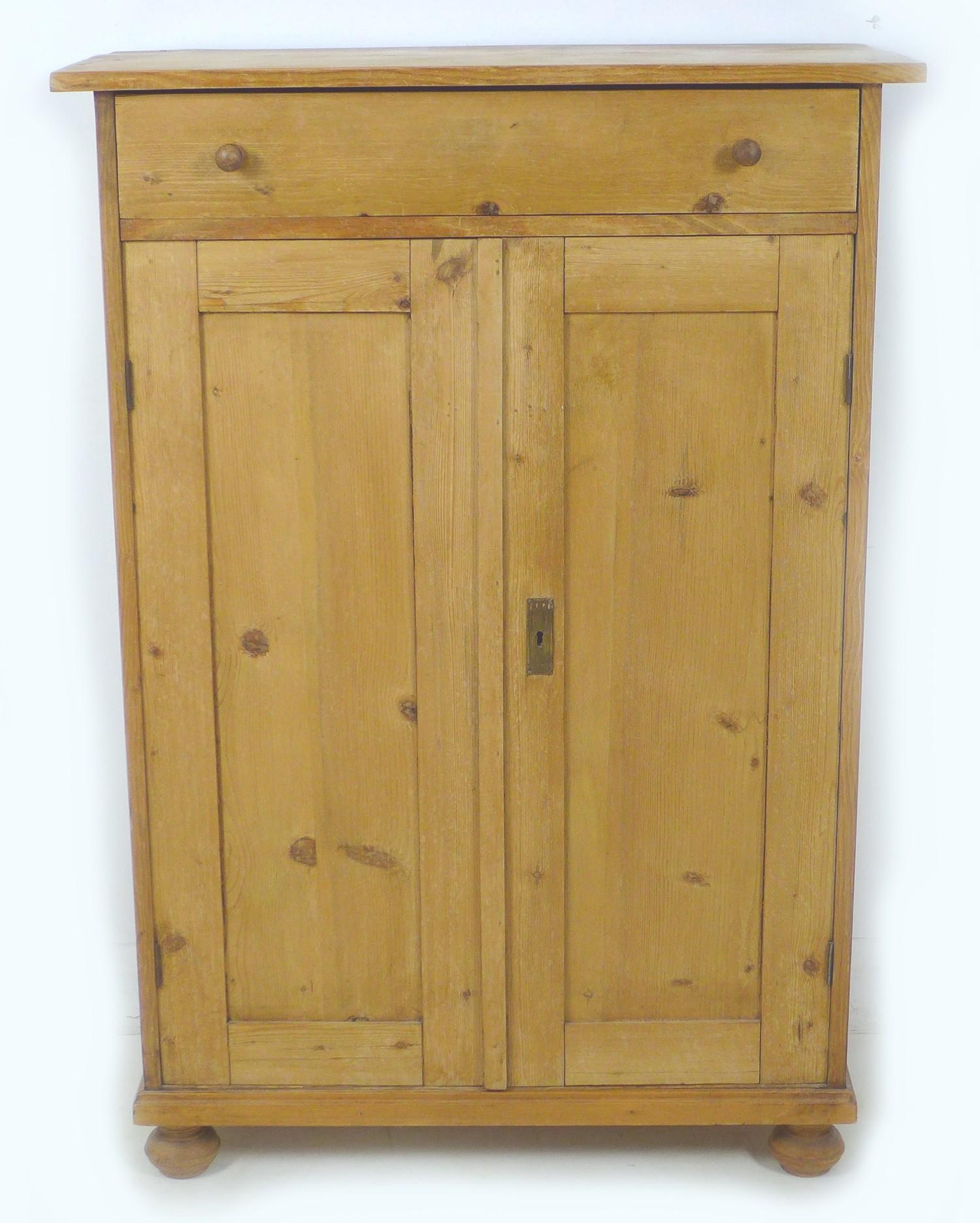 A 19th century Continental pine linen cupboard, possibly French, with single drawer over double