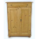 A 19th century Continental pine linen cupboard, possibly French, with single drawer over double