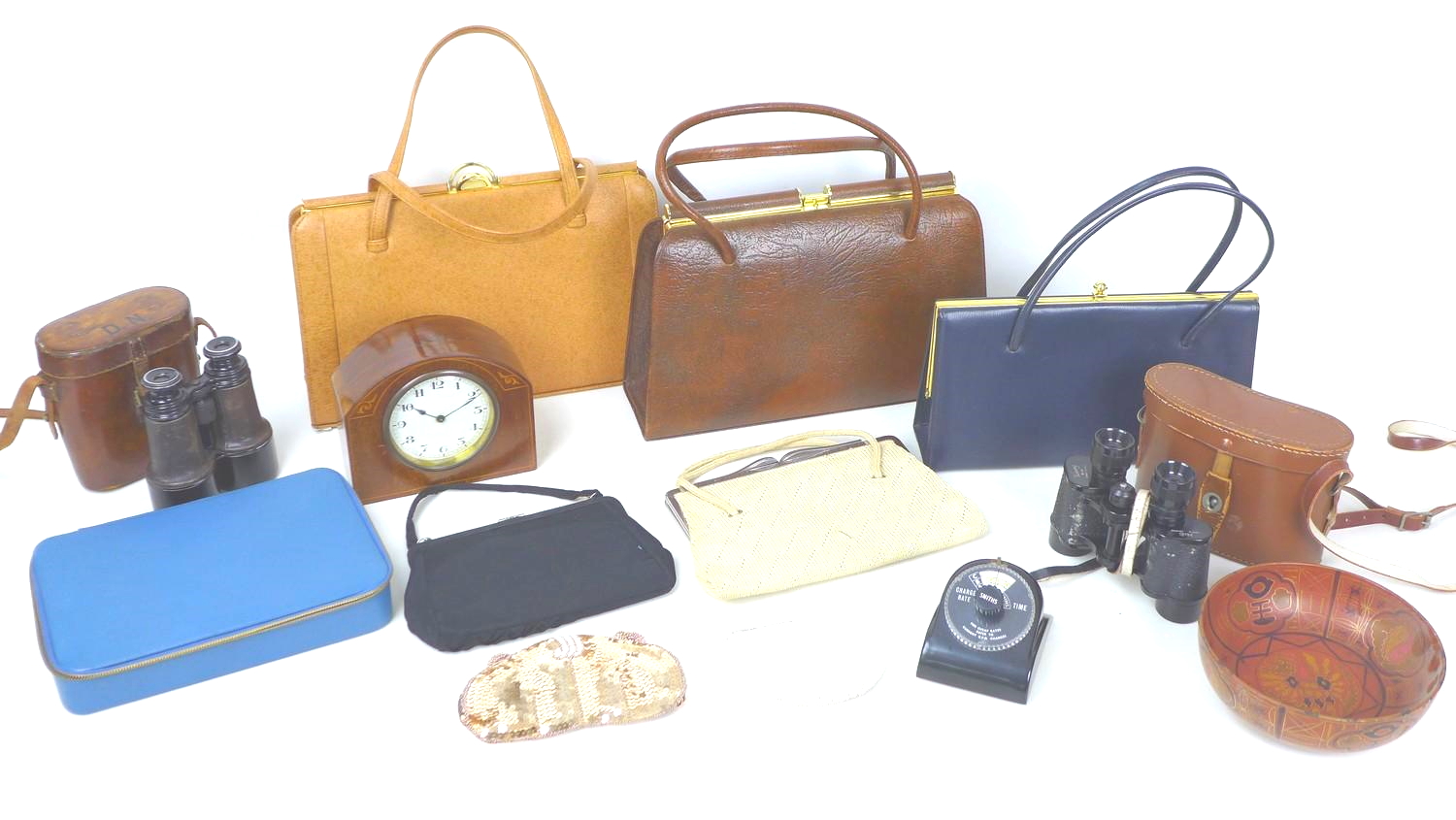 A group of collectables including three retro handbags and two pairs of vintage binoculars, and a